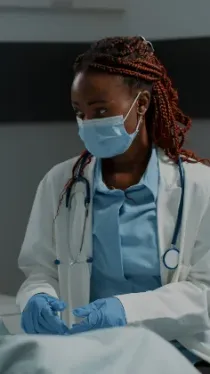 A clinician at work in a consulting room